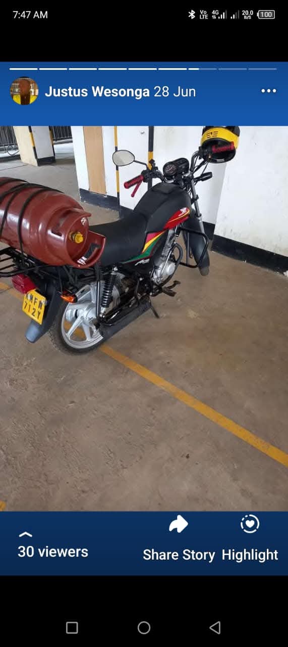 Prime Gas Delivery rider on a motorbike delivering a cooking gas cylinder in Nairobi